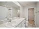 Clean bathroom with double vanity and walk-in closet at 251 Blueberry Ln, Davenport, FL 33837