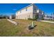 Side view of townhouse with landscaping at 251 Blueberry Ln, Davenport, FL 33837