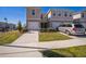 Two-story townhouse with driveway and garage at 251 Blueberry Ln, Davenport, FL 33837