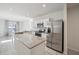 Modern kitchen featuring granite island and stainless steel appliances at 251 Blueberry Ln, Davenport, FL 33837
