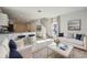 Bright living room with contemporary furniture and kitchen views at 251 Blueberry Ln, Davenport, FL 33837