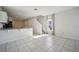 Open concept living area with tile floors and kitchen access at 251 Blueberry Ln, Davenport, FL 33837