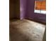 Purple-walled bedroom with tile flooring and a window at 2732 Westside Dr, Leesburg, FL 34748