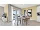 Bright dining room with table and chairs, adjacent to sliding glass doors at 3106 Tobago Dr, Haines City, FL 33844