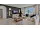 Bright living room featuring a comfy sectional sofa, stylish coffee table, and large windows at 3230 Belize Pl, Haines City, FL 33844