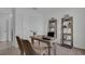 Home office with a desk, two chairs, and built-in shelving at 3230 Belize Pl, Haines City, FL 33844