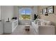Bright and airy office space featuring built-in shelving and a comfortable sofa at 3230 Belize Pl, Haines City, FL 33844