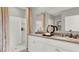 Bathroom boasts double vanity, large shower, and stylish fixtures at 3234 Belize Pl, Haines City, FL 33844