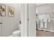 Bathroom with toilet, walk-in closet, and stylish decor at 3234 Belize Pl, Haines City, FL 33844