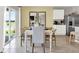 Dining area with white table and chairs near sliding doors at 3234 Belize Pl, Haines City, FL 33844
