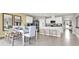 Open concept dining area with kitchen and breakfast bar visible at 3234 Belize Pl, Haines City, FL 33844