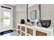 Bright entryway with white console table and large mirror at 3234 Belize Pl, Haines City, FL 33844