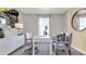 Bright home office features a large window, built-in desk and stylish furnishings at 3234 Belize Pl, Haines City, FL 33844