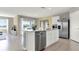 Modern kitchen with stainless steel appliances and island at 3234 Belize Pl, Haines City, FL 33844