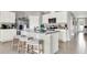 Island kitchen with white cabinets and gray countertops at 3234 Belize Pl, Haines City, FL 33844