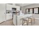 Modern kitchen featuring stainless steel appliances and an island at 3234 Belize Pl, Haines City, FL 33844