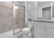 Bathroom with shower and granite vanity at 7424 Oakmoss Loop, Davenport, FL 33837