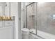 Bathroom with shower and granite vanity at 7424 Oakmoss Loop, Davenport, FL 33837