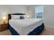 Bedroom with king-size bed and blue accents at 7424 Oakmoss Loop, Davenport, FL 33837