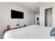 Spacious bedroom with a large bed and TV at 7424 Oakmoss Loop, Davenport, FL 33837