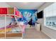 Bedroom with bunk beds and Frozen theme wall at 7424 Oakmoss Loop, Davenport, FL 33837