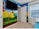 Bedroom with bunk beds and Mario theme wall at 7424 Oakmoss Loop, Davenport, FL 33837
