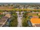Aerial view of community entrance and homes at 7424 Oakmoss Loop, Davenport, FL 33837