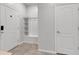 Bright entryway with white built-in bench and storage at 7424 Oakmoss Loop, Davenport, FL 33837