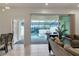 Living room with view of the pool and patio at 7424 Oakmoss Loop, Davenport, FL 33837