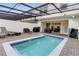 Private, screened-in rectangular pool with patio and pergola at 7424 Oakmoss Loop, Davenport, FL 33837