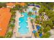 Aerial view of large resort pool with palm trees at 7424 Oakmoss Loop, Davenport, FL 33837