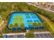 Aerial view of tennis and pickleball courts at 7424 Oakmoss Loop, Davenport, FL 33837