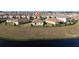 Home situated in a community near a lake at 8990 Ace Loop, Davenport, FL 33896