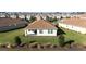 Single-Gathering home with a backyard patio and grassy area at 8990 Ace Loop, Davenport, FL 33896