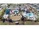 Community pool and recreation area with water slides at 8990 Ace Loop, Davenport, FL 33896