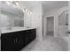 Elegant bathroom with double vanity, soaking tub, and separate shower at 8990 Ace Loop, Davenport, FL 33896