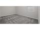 Bedroom featuring gray carpet and a window at 8990 Ace Loop, Davenport, FL 33896