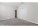 Spacious bedroom with double-door closet and carpet at 8990 Ace Loop, Davenport, FL 33896
