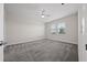 Spacious bedroom with ceiling fan and carpeted floors at 8990 Ace Loop, Davenport, FL 33896