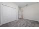 Bedroom with double door closet and gray carpet at 8990 Ace Loop, Davenport, FL 33896