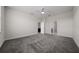 Large bedroom with plush carpeting and access to bathroom at 8990 Ace Loop, Davenport, FL 33896