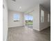 Bright dining room with sliding glass doors to patio at 8990 Ace Loop, Davenport, FL 33896