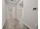 Bright hallway with tile flooring and access to other rooms at 8990 Ace Loop, Davenport, FL 33896