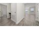 Clean hallway featuring tile floors and built-in storage at 8990 Ace Loop, Davenport, FL 33896