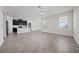 Open kitchen with island, dark cabinets, and stainless steel appliances at 8990 Ace Loop, Davenport, FL 33896