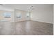 Bright living room with tile floors and ceiling fan at 8990 Ace Loop, Davenport, FL 33896