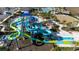 Aerial view of community water park with slides and pool at 8990 Ace Loop, Davenport, FL 33896