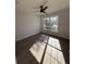 Bright bedroom with wood-look floors and ceiling fan at 911 Pine Ave, Mount Dora, FL 32757