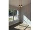 Bright dining room with large windows and modern light fixtures at 911 Pine Ave, Mount Dora, FL 32757