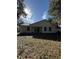 Newly built home with covered patio and backyard at 911 Pine Ave, Mount Dora, FL 32757